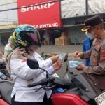 Polres Lubuk Linggau dan PMII Bagikan 1.500 Masker Gratis, Peduli Kesehatan Masyarakat